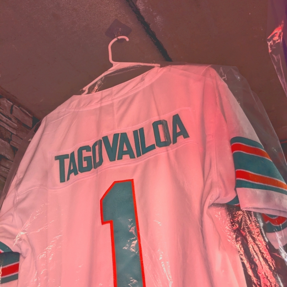 Dolphin fans, I'm selling a Tua set, that includes a orange strap on hat and soc